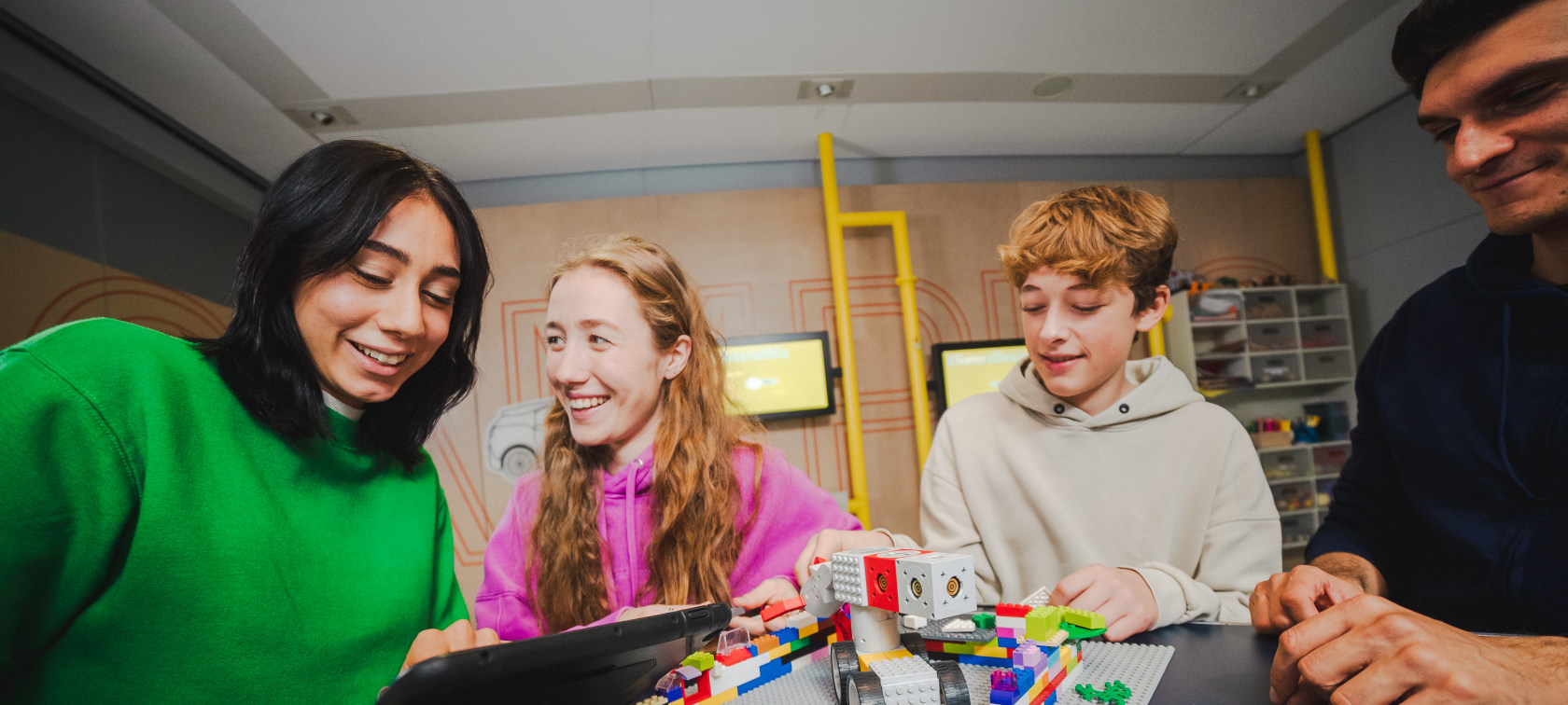 Workshop participants create a Lego model together in a workshop at BMW Welt 