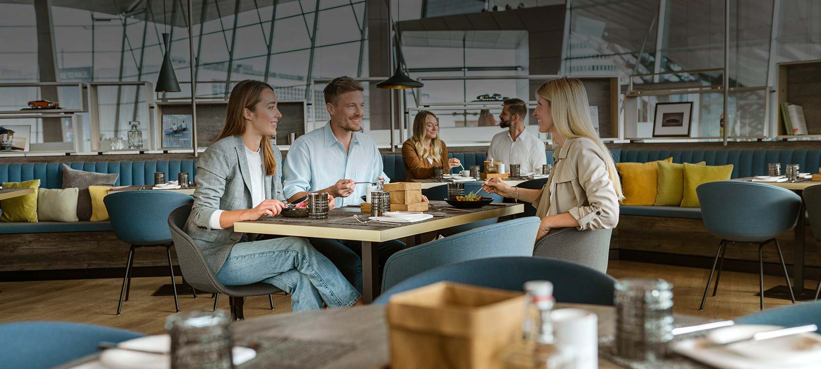 laughing people enjoy dining together