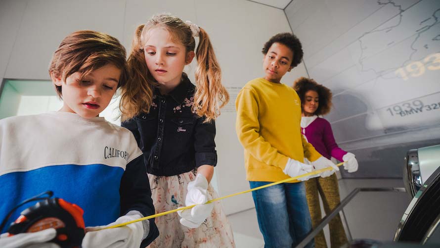 Children measure vehicles in BMW Museum to find clues 