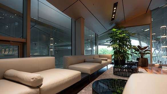 Furniture and equipment Comfortable couch in cream white in the waiting area of BMW Welt Business Club